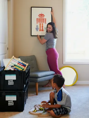 Couple embracing eachother in front of moving boxes.